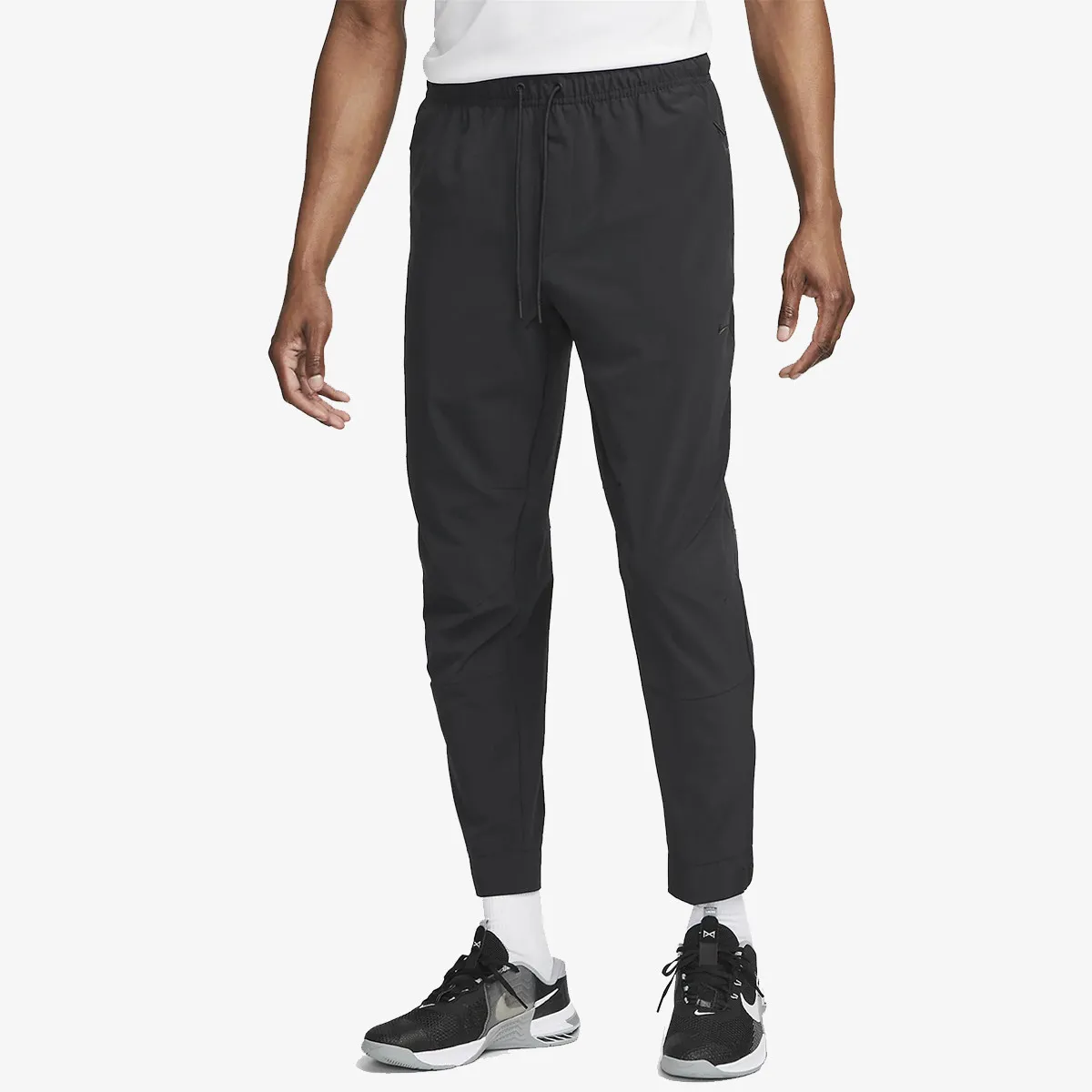 NIKE Hlače M NK DF UNLIMITED PANT TPR 